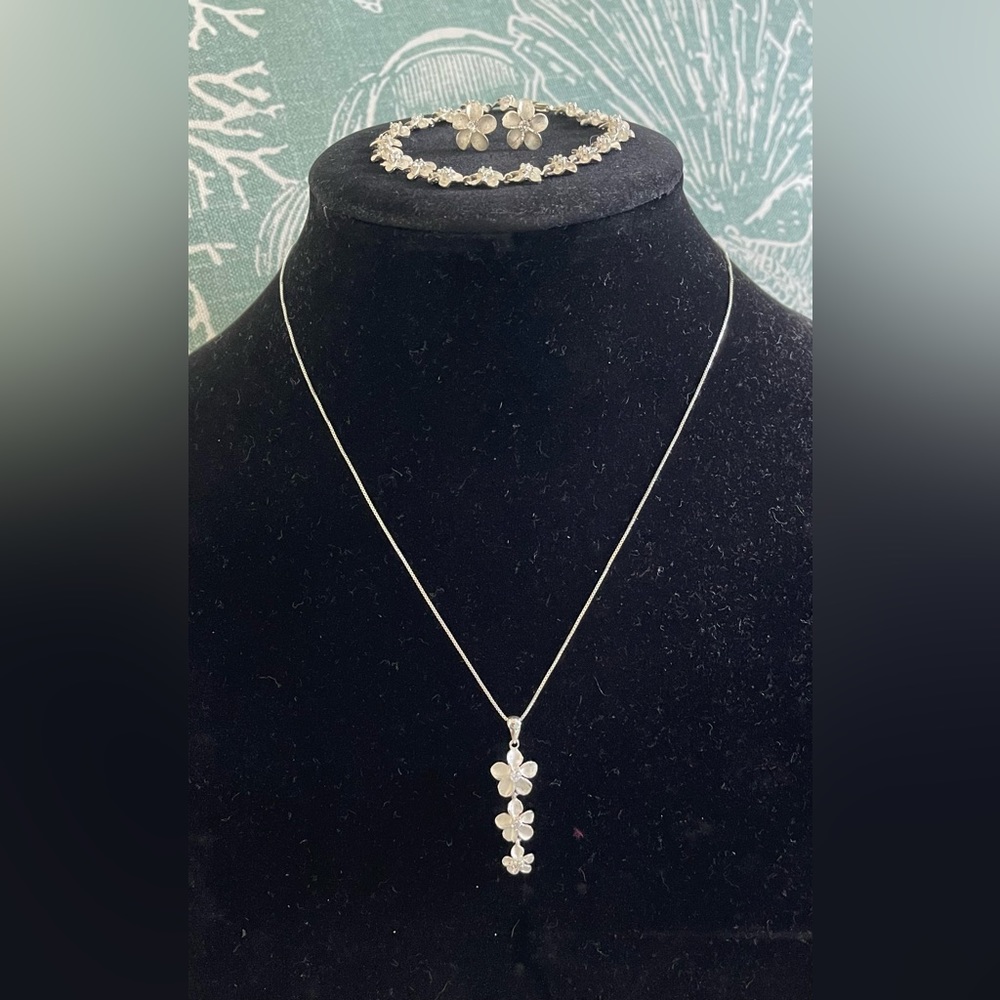 Three piece set of Sterling Silver Genuine Hawaiin Plumeria Jewelry